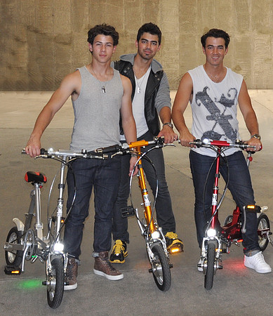 Jonas Brothers with the VeloMini Electric Folding Bicycle